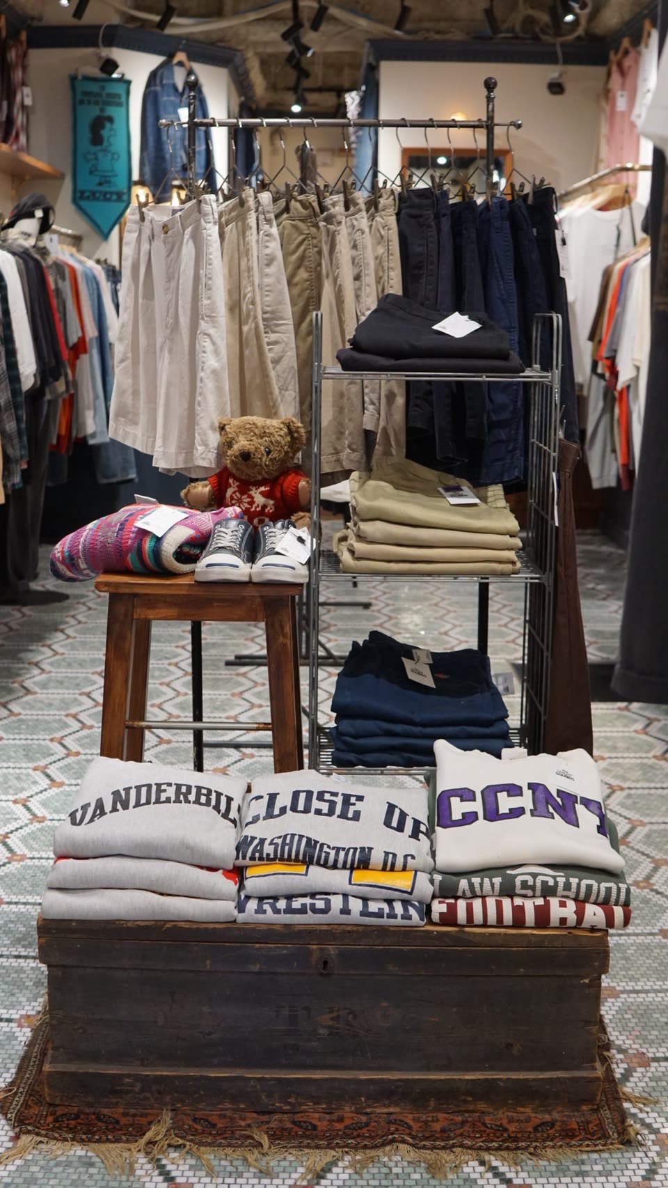 Accessories displayed on a stool and shelving